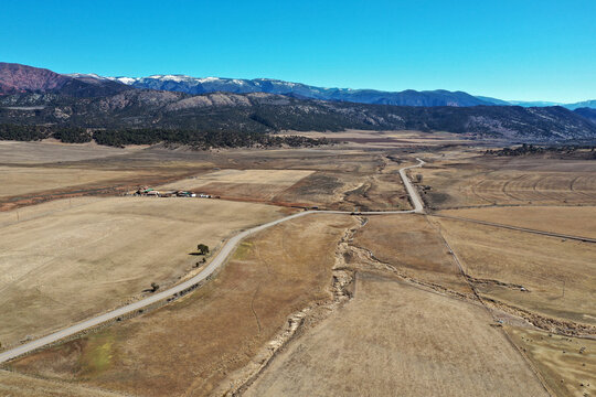 Aerial view of Grass Valley agricultural area in Garfield County, Colorado on sunny late winter morning with Grand Hogback Ridge in background.