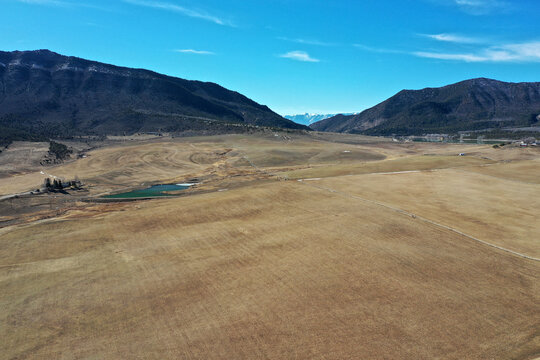 Aerial view of Grass Valley agricultural area in Garfield County, Colorado on sunny late winter morning with Grand Hogback Ridge in background.
