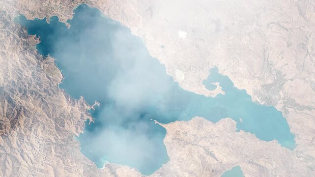 Flying over Lake Van Turkey satellite view from space with passing clouds based on Nasa imagery