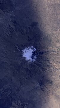 Vertical sunrise timelapse over Mount Ararat Turkey snow covered volcano satellite view from space based on Nasa imagery