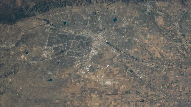 Flying over Denver Colorado with Rocky Mountains satellite view from space based on Nasa imagery