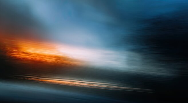 Abstract burst of fiery orange light against dark stormy sky