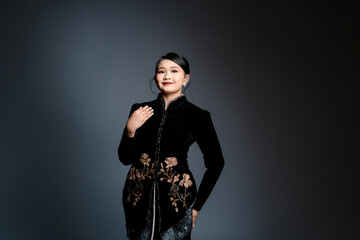 Fototapeta premium black kebaya with gold floral embroidery