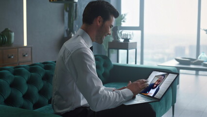 Fototapeta premium Business owner video meeting by laptop discussing work with partner close up.