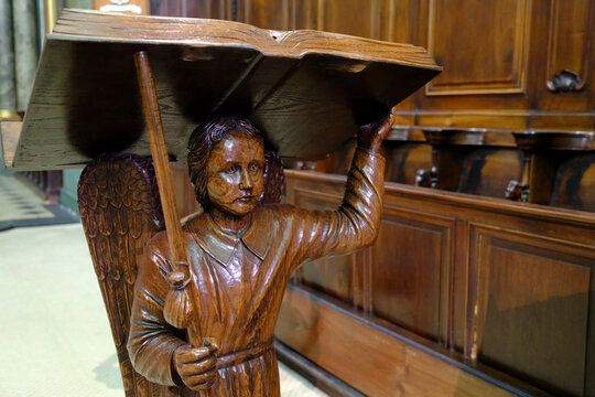 Saint Pierre cathedral.  Baroque carved wood angel serving as a church lectern.  Annecy. France.