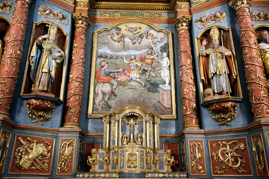 Saint Maurice church.  Baroque altarpiece. 18th century. Martyr of Saint Maurice, immolated before the statue of a pagan god.  Thones. France.