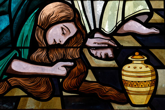 Saint Maurice church. Church window depicting Mary Magdalene at Jesus' feet with an alabaster jar of ointment.  Thones. France.