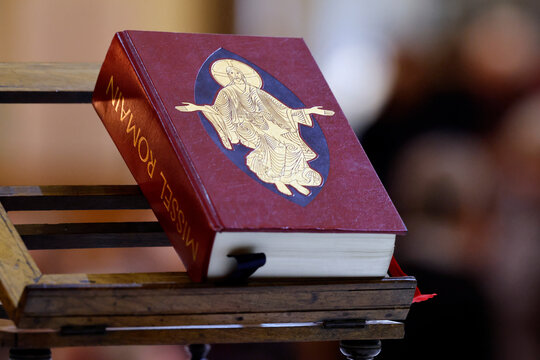 Saint Maurice church. Closed Roman Missal with an iconic image of Christ in glory on its red cover.  Thones. France.