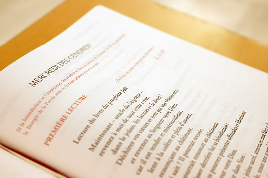 Saint Paul church. Liturgical booklet open to the Ash Wednesday service with readings from Joel. Annecy. France.