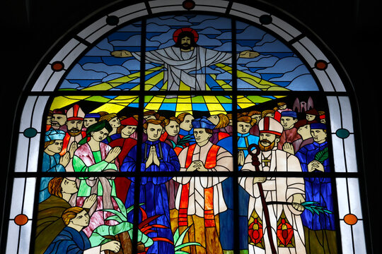  Vietnamese Martyrs Church. Stained glass window portraying the glorification of Vietnamese martyrs beneath a radiant Christ. Ho Chi Minh city. Vietnam.