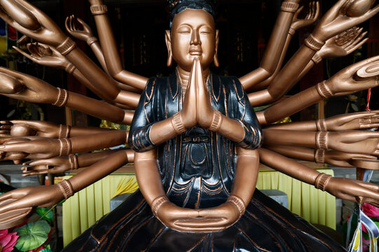 Phuc Lam Du Pagoda.  Bronze thousand-armed Guanyin statue seated in meditation  Haiphong. Vietnam.