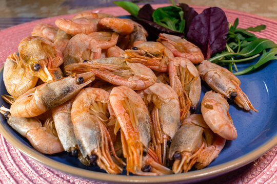 Fresh boiled shrimp with herbs on a plate