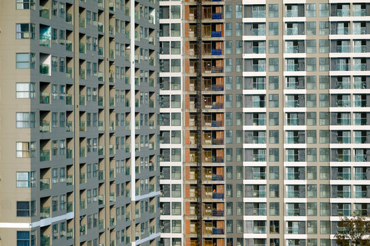 The repetitive grid of apartment building facades reveals urban density in a Vietnamese city.  Vung Tau. Vietnam.