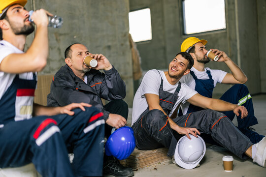 Construction Workers Drinking Coffee on Site
