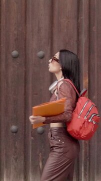 Happy university student dancing in the street. door, Background,