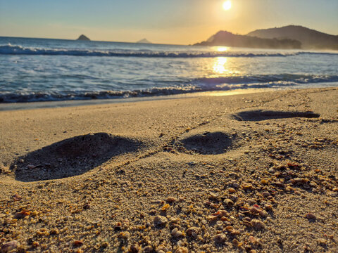Incredible orange sunset on a paradisiacal beach.