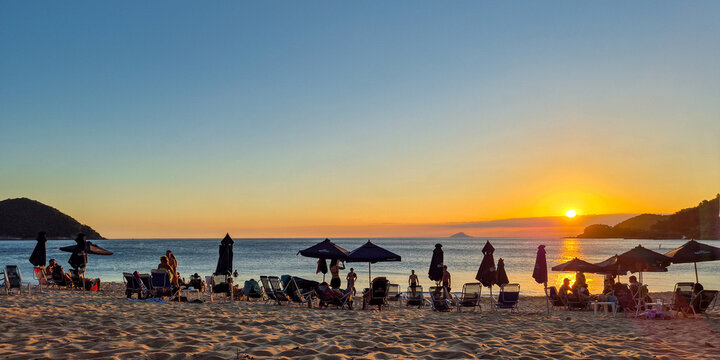 Incredible orange sunset on a paradisiacal beach.