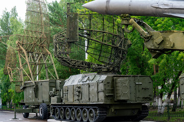 Fototapeta premium Military Radar Vehicle With Antenna Arrays And Missile Components Displayed In Outdoor Museum