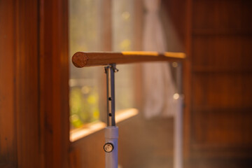 Close up of ballet barre in classroom for choreography and stretching exercises.
