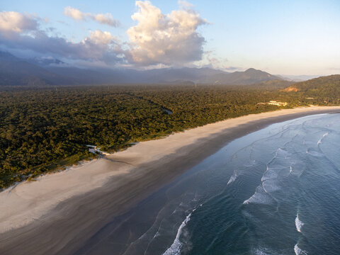 Aerial wide view of Boraceia beach and lush Atlantic forest in Sao Sebastiao, Brazil