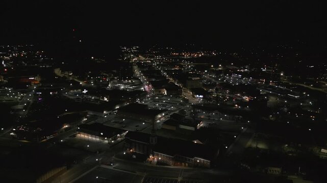Small down at night with street lights and traffic. Downtown johnson city Tennessee at night 
