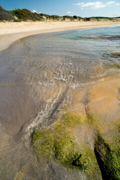 waves on the shore at sunset, Porto Ferro, Sassari, Alghero, Sardinia, Italy