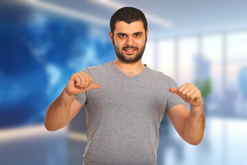 Naklejka premium Man points downward with both hands
