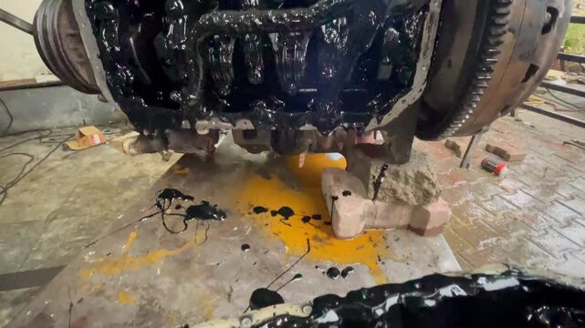 Dirty Engine Oil Sludge Inside Engine Block, Close-up footage of a heavily contaminated car engine block filled with thick black oil sludge, automotive failure, lubrication issues, dirty engine.