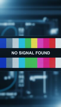 Television screen displaying a no signal found message with a color bar test pattern, indicating technical issues or broadcast interruptions against a blurred background