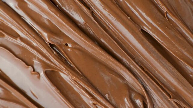 Creamy delicious chocolate melted cream texture background top view