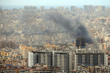 Naklejka premium Smoke Rises from Beirut Southern Suburbs After Israeli Strike Lebanon Conflict