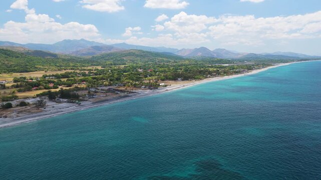 Scenic Panorama Drone Aerial Video of the crystal clear water and the beach and Mount Katung-uhan in Botolan, Zambales in the Philippines