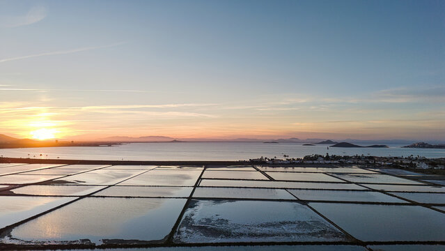 Sunset over coastal salt flats with copy space in La Manga Murcia Spain