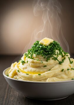 Creamy, buttery mashed potatoes served hot in a rustic white bowl, topped with vibrant green fresh snipped chives, ready to eat, starch, green, butter