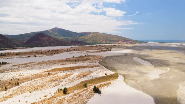 Scenic Aerial Panorama Drone Video of the Bucao River and mountain range and Mount Katung-uhan, with Volcanic Ash in Botolan, Zambales in the Philippines