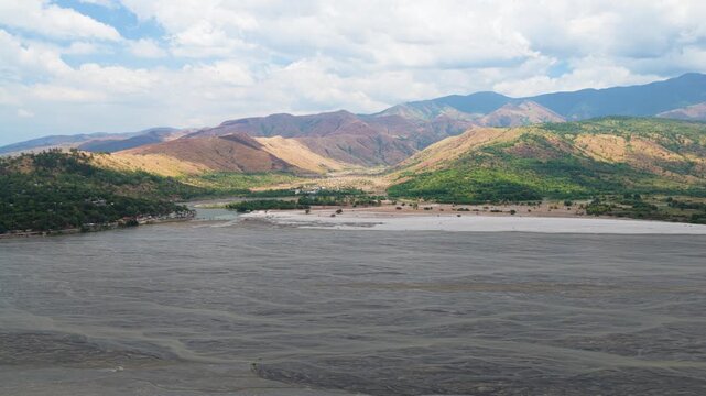 Scenic cinematic Aerial Panorama Drone Video of the Baquilan River and mountain range with Volcanic Ash in Botolan, Zambales in the Philippines