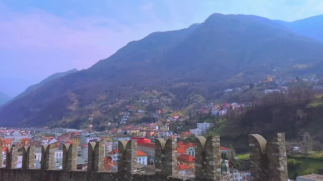 Panorama with battlements of Castelgrande and Alps, Bellinzona, Switzerland