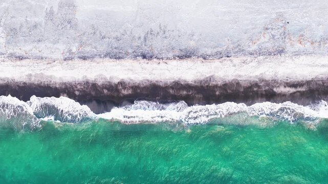 Scenic bird's eye top down view dron video of the crystal clear water and the beach and in Botolan, Zambales in the Philippines