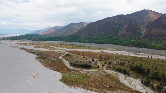 Scenic Aerial Panorama Drone Video of the Bucao River and mountain range and Mount Katung-uhan, with Volcanic Ash in Botolan, Zambales in the Philippines
