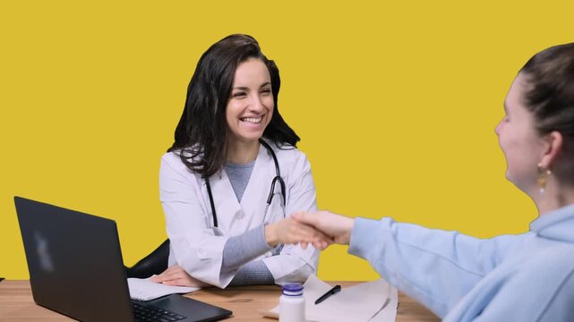 Female doctor giving recommendations for treatment for lady on the yellow chroma key