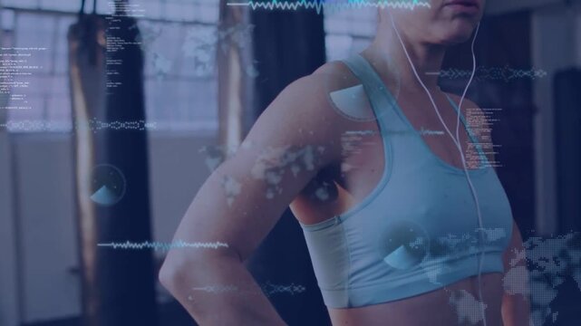 Vertical video: Finishing sparring round woman in sports bra breathing at boxing gym, data overlay
