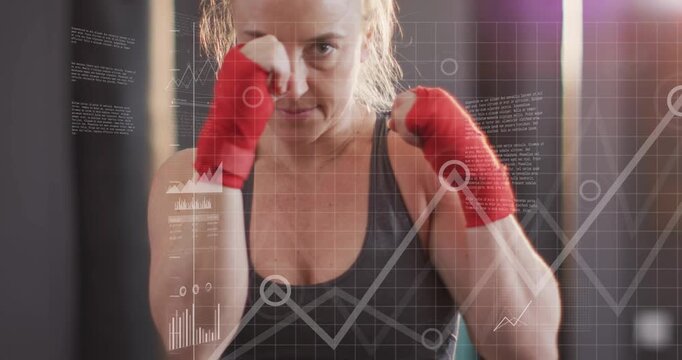 Vertical video: Tightening guard woman training boxing at gym, sports bra, red wraps and HUD cueing