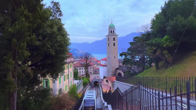 Sassellina funicular and bell tower of Lugano Cathedral, Switzerland