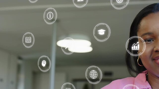 Woman presenter smiling in office as education icons appearing and floating in front for learning