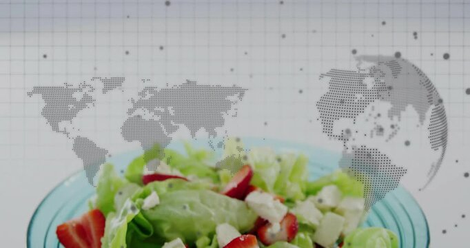 Turquoise bowl entering rising zooming showing salad on grid with map globe overlaying for food ads