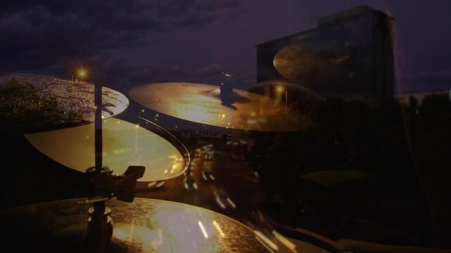 Drummer hands entering frame tapping hi-hat and ride cymbals, creating music with light trails