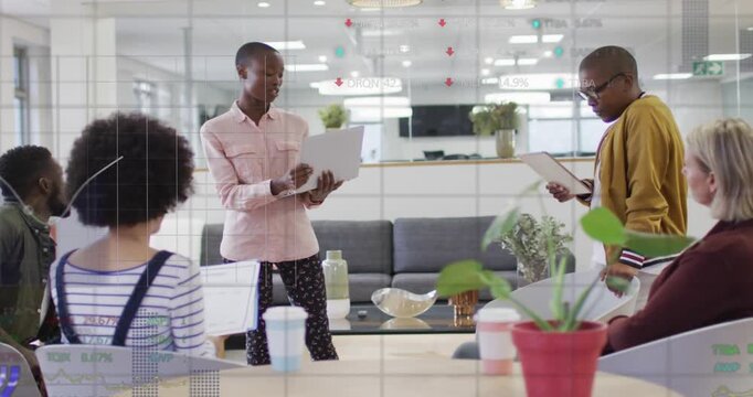 Presenter tapping laptop, gesturing in office, causing animated charts to align with business brief