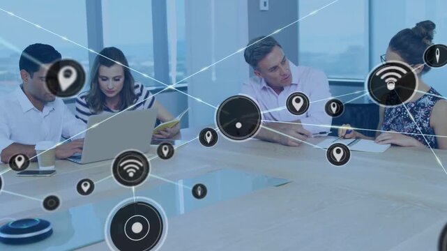 Business team working at table pulsing icon creating network mesh covering table showing data