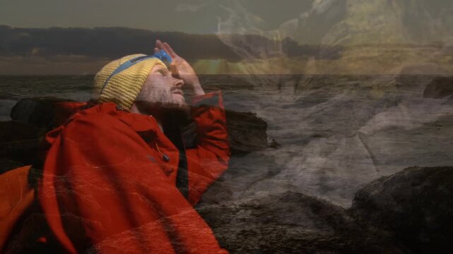 Animation of male speleologist with equipment over seascape at sunset