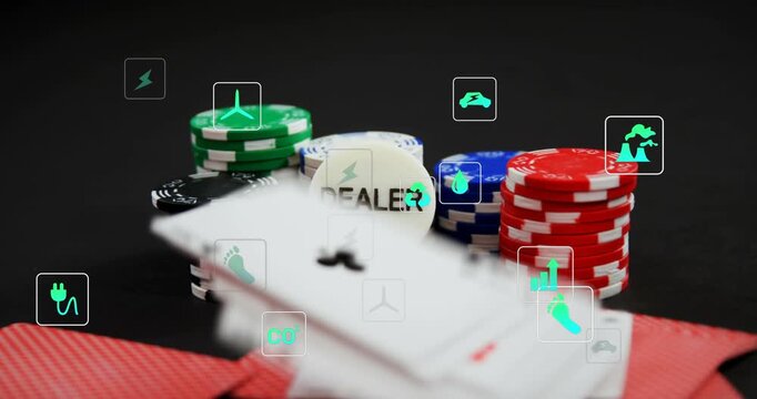 A poker game going on in a casino, with various electronic devices and a computer screen in the back